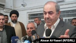 Iyad Allawi speaks to the press in Najaf.