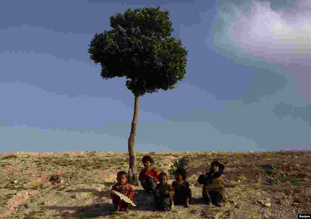 Afghan children sit on a hill in Kabul. (Reuters/Mohammad Ismail)