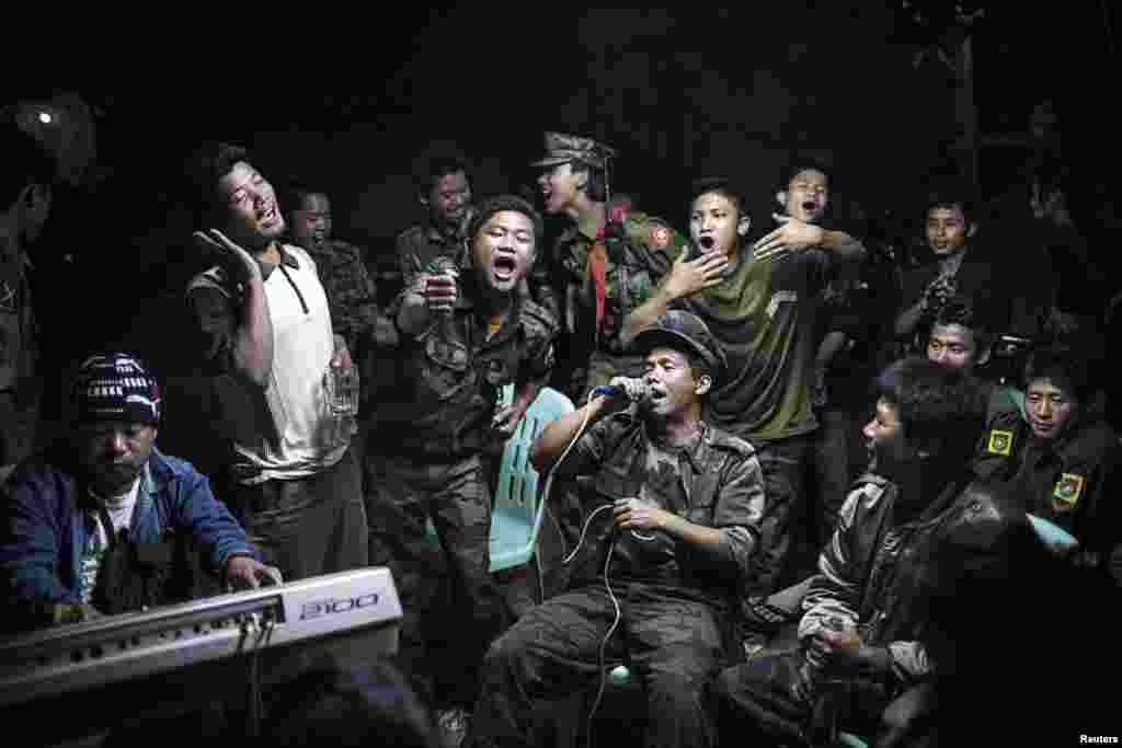 Julius Schrank, a German photographer working for De Volkskrant, won first prize in the Daily Life Single category with this picture of rebel fighters of the Kachin Independence Army in Burma singing at a funeral of one of their commanders.