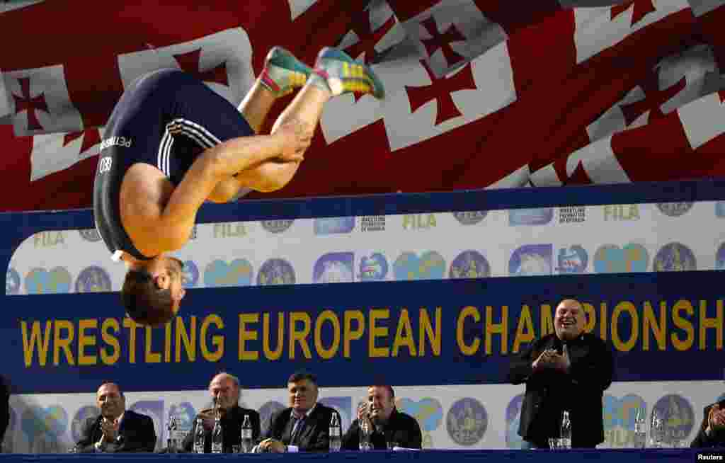 Georgia's Geno Petriashvili celebrates after winning a bronze medal during the Free Style Wrestling 120kg bronze-medal match against Germany's Nick Matuhin at the Senior Wrestling European Championship in Tbilisi. (Reuters/David Mdzinarishvili)