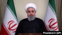 IRAN -- Iranian President Hassan Rouhani addresses the nation in a televised speech in Tehran, May 8, 2018