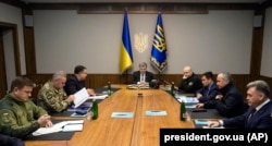 Ukrainian President Petro Poroshenko (center) chairs an extraordinary meeting of the Military Cabinet of the National Security and Defense Council of Ukraine in Kyiv on November 21.