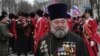A Russian Orthodox priest attends a rally marking the second anniversary of Russia's annexation of Ukraine's Crimea region in the Black Sea port of Sevastopol on March 18. 