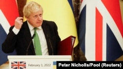 Boris Johnson speaks to reporters during his visit to Kyiv on February 1.