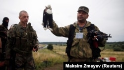 A pro-Russian separatist holds a stuffed toy found at the crash site of Malaysia Airlines Flight MH17 in eastern Ukraine on July 18. 