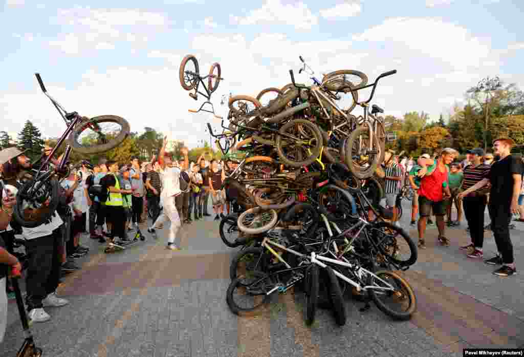 Riders throw their bikes in a heap after a mass ride in Almaty, Kazakhstan. (Reuters/Pavel Mikheyev)