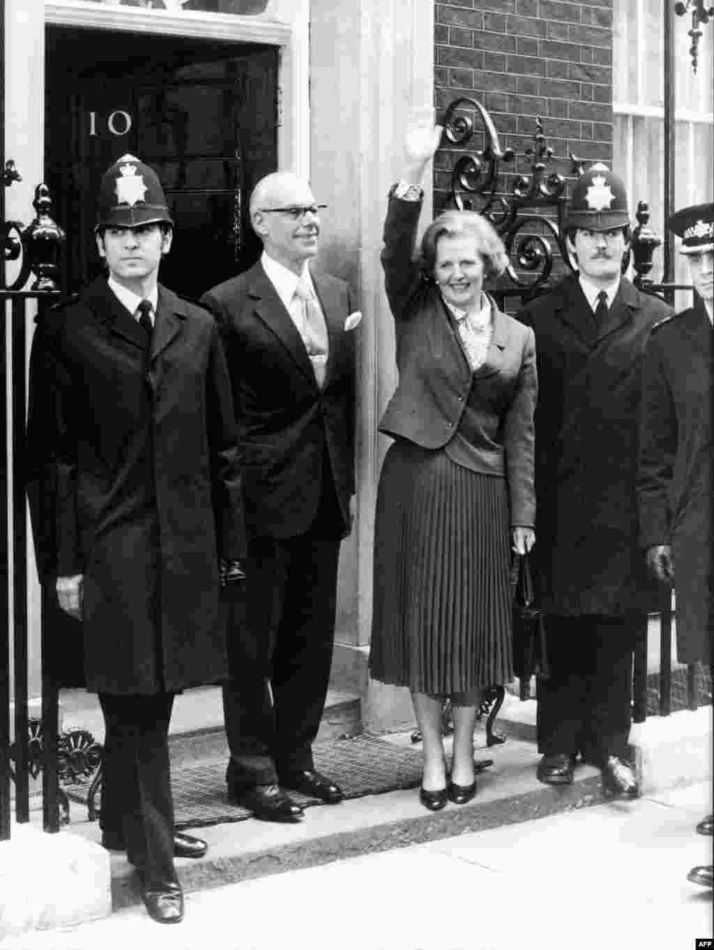 British Prime Minister Margaret Thatcher waves as she arrives at 10 Downing Street to take office on May 4, 1979.