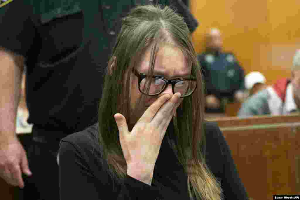 Anna Sorokin cries during her sentencing at the New York State Supreme Court in New York on May 9. Sorokin, the Russian-born con artist who passed herself off as a wealthy heiress to swindle banks, hotels, and even close friends, was sentenced to four to 12 years behind bars. (AP/Steven Hirsch/New York Post)
