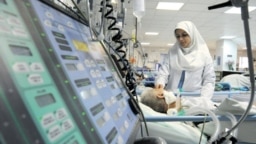 A nurse attending a patient in an Iranian hospital. File photo