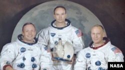 Neil Armstrong (left) with his fellow crew members from the Apollo 11 mission, Michael Collins (center) and Edwin "Buzz" Aldrin.