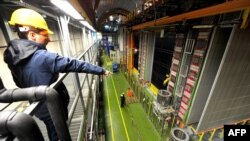 A file photo shows scientists looking at equipment at the Gran Sasso National Laboratory as part of a repeat experiment in cooperation with the European Organization for Nuclear Research.