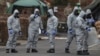 Military personnel wearing protective clothing work in areas that are feared to be contaminated with Novichok in Salisbury, England, on March 11.