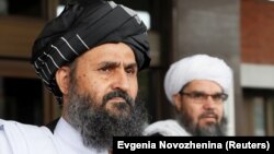 FILE: The Taliban negotiating team has been led by Mullah Abdul Ghani Baradar (L), who co-founded the movement with the late Mullah Mohammad Omar.
