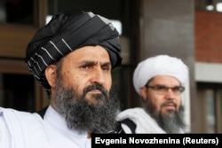 Mullah Abdul Ghani Baradar (front) leaves after peace talks with Afghan senior politicians in Moscow in May 2019.