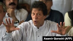 FILE: Imran Khan gestures as he addresses members of the media in July, 2017.