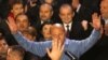 Incumbent President Traian Basescu reacts after first exit-poll results were made public at Liberal Democratic party headquarters in Bucharest late on December 6.