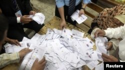 Electoral coordinators count votes at a school used as a polling station in Cairo after Egypt's presidential elecitons on May 24.