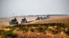 Turkish Army tanks drive near the Syrian border after the August launch of the military campaign.