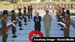 Afghan President Ashraf Ghani (left) and Pakistani army chief General Raheel Sharif offering prayers at a Pakistani war memorial in Islamabad on November 14.