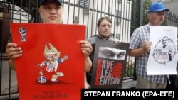 UKRAINE – Activists holds posters with images of Ukrainian film director Oleh Sentsov, during a rally in support of Sentsov and other Ukrainian political prisoners jailed in Russia, in front of the Russian embassy in Kyiv, 13 June 2018UKRAINE –Activists h