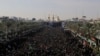 Iraqi Shi'ite Muslim pilgrims gather during the Arbain religious festival, between the Imam Hussein and Imam Abbas shrine 80 kilometers south of Baghdad in December 2014.