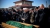 Members of the Crimean Tatar community pray over the coffin of Reshat Ametov during his funeral in Simferopol on March 18. His body bore the marks of a violent death, according to Human Rights Watch.