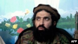 Former Tehreek-e Taliban Pakistan (TTP) spokesman Shahidullah Shahid speaks during a press conference at an undisclosed location in Pakistan in February 2014.