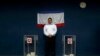 Чиновник стоит между двумя урнами для голосования во время проведенного Россией «референдума» в Крыму. Бахчисарай, 16 марта 2014 года