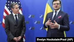 U.S. Secretary of State Antony Blinken (left) and Ukraine's Foreign Minister Dmytro Kuleba in Brussels on April 7.
