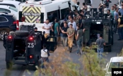 Police arrest Turkish soldiers at Taksim Square in Istanbul, which was held briefly by the military during a coup attempt on July 16.