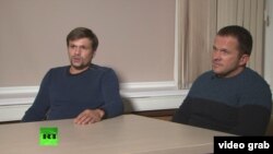 A screen grab from RT's interview with Aleksandr Petrov and Ruslan Boshirov to discuss claims made by London that they were involved in the poisoning of a former Russian spy and his daughter in Salisbury. 