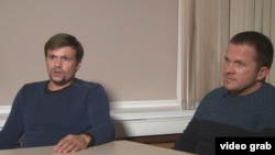 Two men carrying passports with the names Ruslan Boshirov (right) and Aleksandr Petrov are among those who have been hit with sanctions. (file photo)