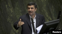 Iranian President Mahmud Ahmadinejad speaks to parliamentarians before presenting his proposed budget in Tehran on February 1.
