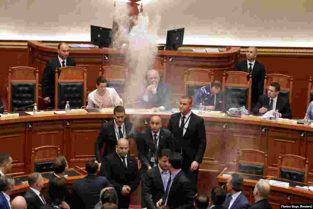 Members of the opposition throw flour at Prime Minister Edi Rama during a parliamentary session in Tirana, Albania. (Reuters/Florion Goga)