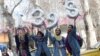 Iranian women hold numbers forming the Persian New Year 1398, Norooz, on New Year eve in Tehran, March 20, 2019