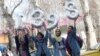 Iranian girls hold up numbers forming the Persian new year 1398 ahead of Norouz in Tehran on March 20.