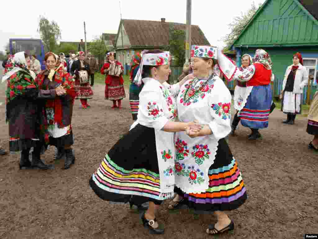 Women in national costume dance during Yurya, a celebration to ensure good harvests, in the village of Pogost, Belarus, on May 6. Photo by Vasily Fedosenko for Reuters