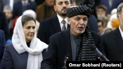Afghan President Ashraf Ghani, alongside his wife, Rula Ghani, speaks to the media in January 2019 in Kabul.