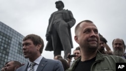 Oleh Tsarev (left) is seen with separatist leader Aleksandr Borodai in Donetsk in June 2014.