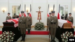 The coffins of President Lech Kaczynski (left) and his wife Maria Kaczynska are laid out in Presidential Palace in Warsaw.