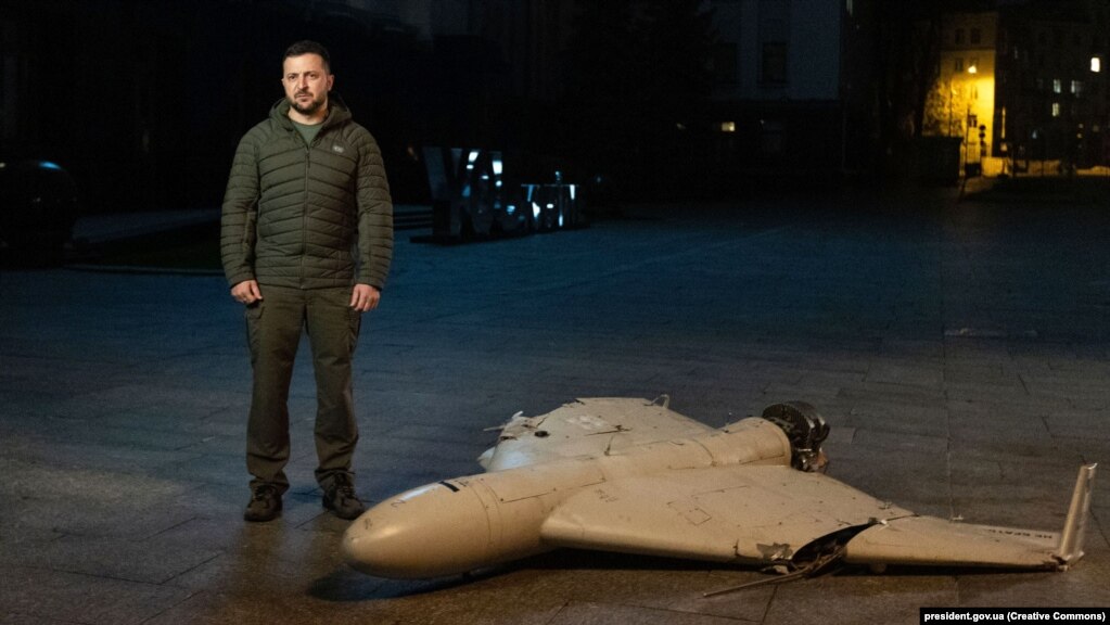 Ukrainian President Volodymyr Zelenskiy poses next to a downed Iranian-made Shahed-136 kamikaze drone in Kyiv on October 27.
