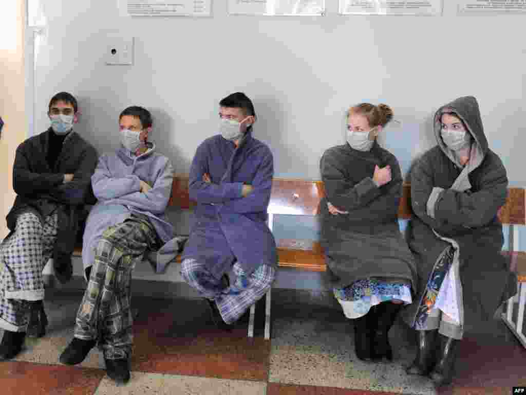 Patients suspected of carrying the H1N1 swine flu virus wait to be examined at a hospital in Minsk, Belarus.