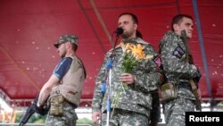 Separatist leader Pavel Gubarev speaking in Donetsk July 6.