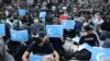 Hong Kong protesters hold East Turkestan Uyghur flags at a rally in support of Xinjiang Uyghurs' human rights. (file photo) 