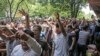 A group of protesters rally at the old Grand Bazaar in Tehran in June. 