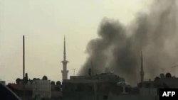 A video posted on April 5 shows smoke billowing from reported shelling in Duma, outside Damascus.