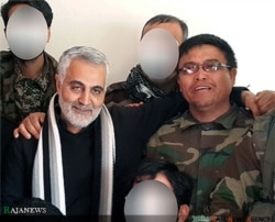 Qasem Soleimani (left) with Afghan Alireza Tavasoli, commander of the Fatemiyoun Brigade, who was killed fighting in Syria. (undated photo)