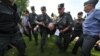 Russian police detain a gay-rights supporter during a protest rally in St. Petersburg in July. Critics fear the authorities will use the new law to jail any dissenters.