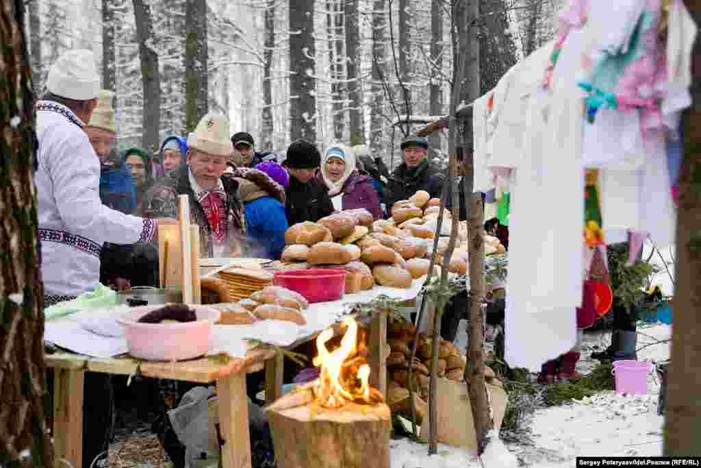 The Mari priests, known as Karts, wear white hats as they oversee the rituals. 