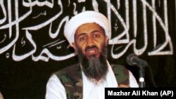 FILE: Osama bin Laden is seen at a news conference in Khost, 1998.